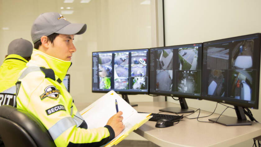 Flex Point Security's CCTV video alarm system response team sitting in an office with monitors