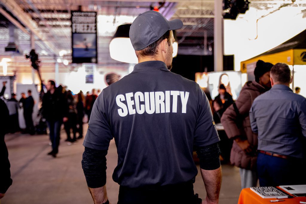 Male Flex Point Security guard providing event security at a conference centre in Ontario