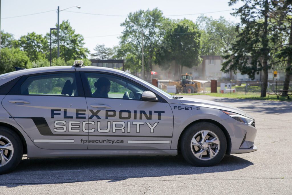 A grey Flex Point Security company vehicle being used for mobile patrol in Toronto