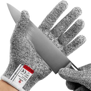 Close up of a NoCry Cut Resistant Glove with a knife trying to slice it