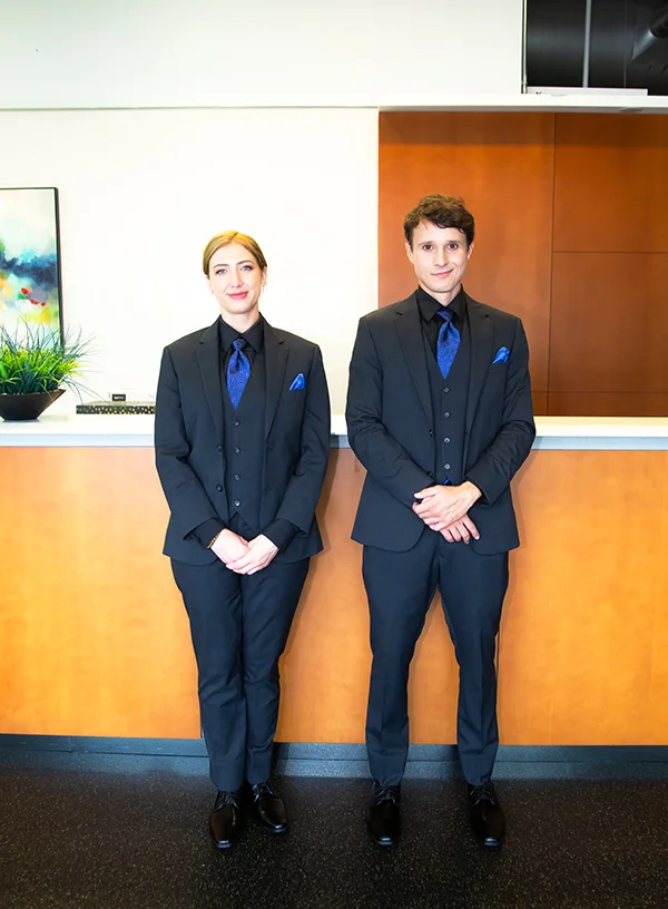 Two Flex Point Access control / concierge service guards dressed in suits standing together