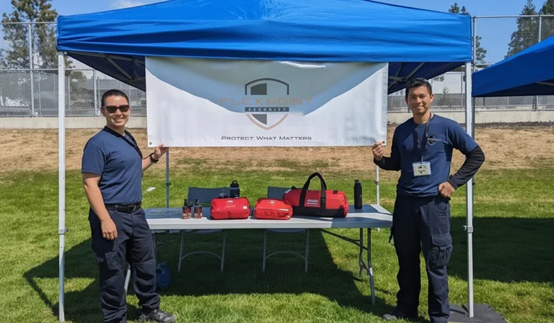 A Flex Point Security event medical services tent up with two Flex Point staff members on-site