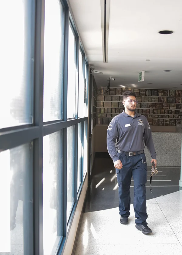 A male Flex Point Security guards on-site at a client's office in Downtown, Toronto.