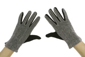 Close up of a person's hands while wearing grey gloves